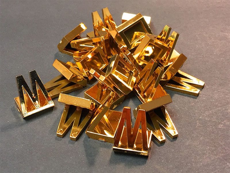 plastic pieces gold plated game pieces
